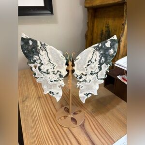Moss Agate butterfly with a gold-colored metal stand. Druzy and small portal